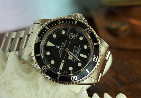 Rolex Submariner with black bezel on a starfish