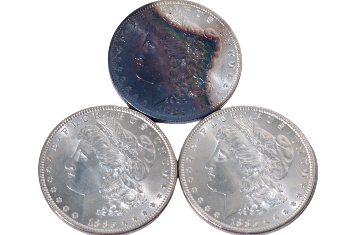 3 toned coins Morgan silver dollars