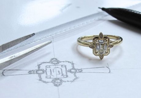 Custom engagement ring drawn out with ring next to it