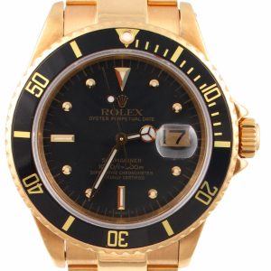 Pre-Owned 1980 Yellow Gold Rolex Submariner 40MM Watch With Black Nipple Dial And Black Bezel With Oyster Band Model# 16808 face view