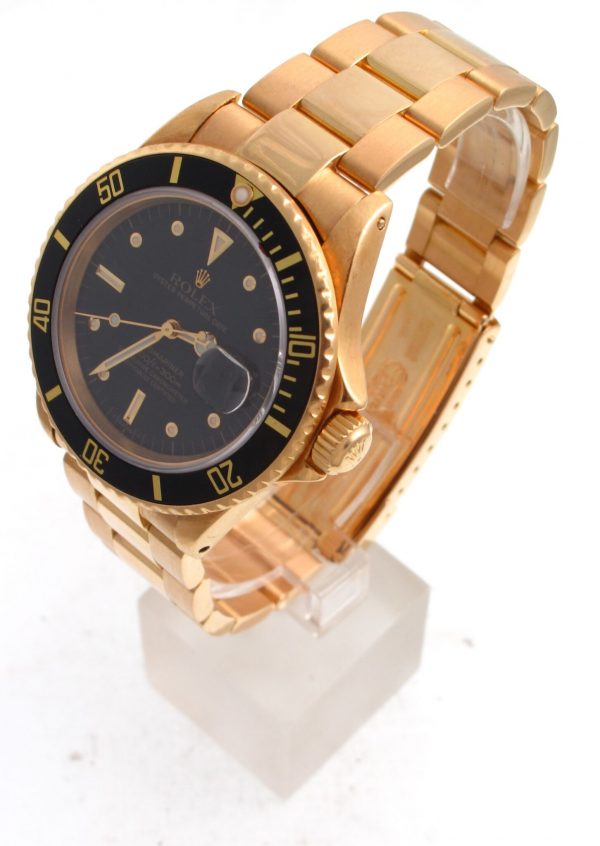 side view Pre-Owned 1980 Yellow Gold Rolex Submariner 40MM Watch With Black Nipple Dial And Black Bezel With Oyster Band Model# 16808