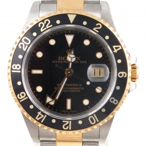Pre-Owned 2000 Rolex GMT Master II 40MM Watch Two Tone With Black Dial and Black Bezel With Oyster Band Model 16713 face view