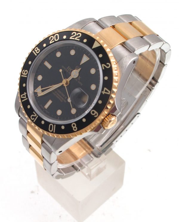 Pre-Owned 2000 Rolex GMT Master II 40MM Watch Two Tone With Black Dial and Black Bezel With Oyster Band Model 16713 right side
