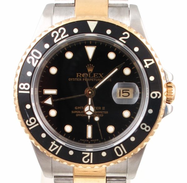 Pre-Owned 2002 Rolex GMT Master II 40MM Watch Two Tone With Black Dial and Black Bezel With Oyster Band Model 16713
