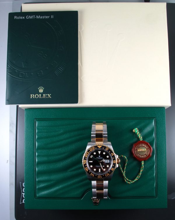 2008 Two Tone Pre-Owned Rolex GMT Master II 40MM Watch With Black Index Dial And Black Ceramic Bezel With Oyster Band Model# 116713 Box Papers Outter