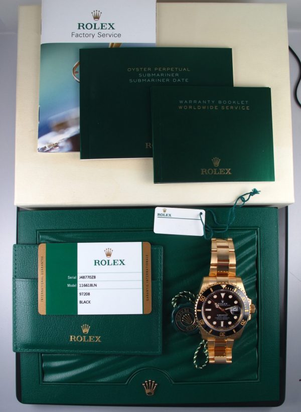 Pre-Owned Rolex Submariner 40MM 2018 18kt Yellow Gold Watch With Black Dial And Black Ceramic Bezel With Oyster Band Model# 116618LN box and papers