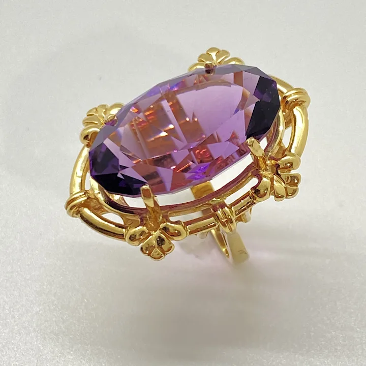Big amethyst statement ring set in yellow gold