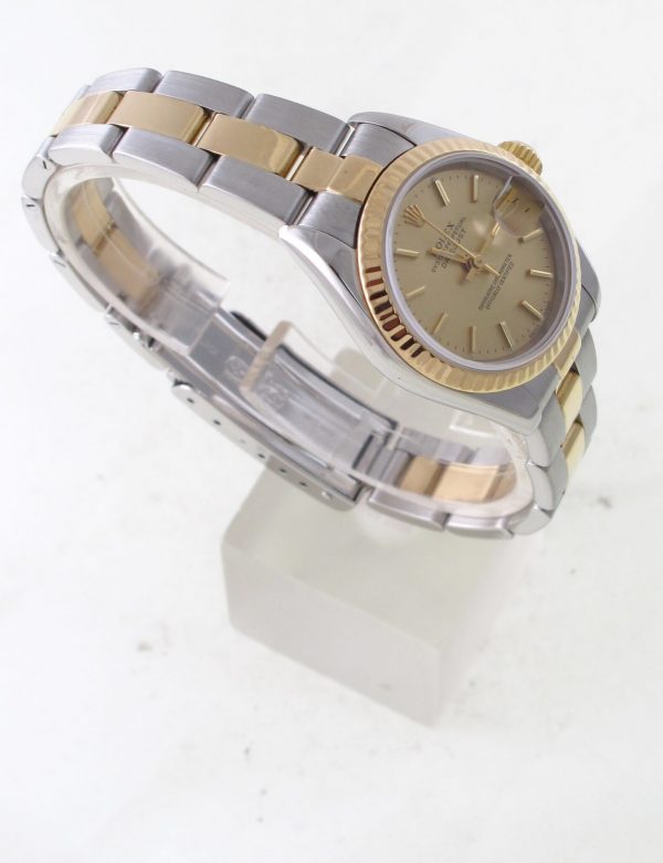 Pre-Owned 2000 Ladies Two Tone Gold Datejust 26MM Watch With Champagne Stick Dial And Fluted Bezel With Oyster Band Model#79173 Left