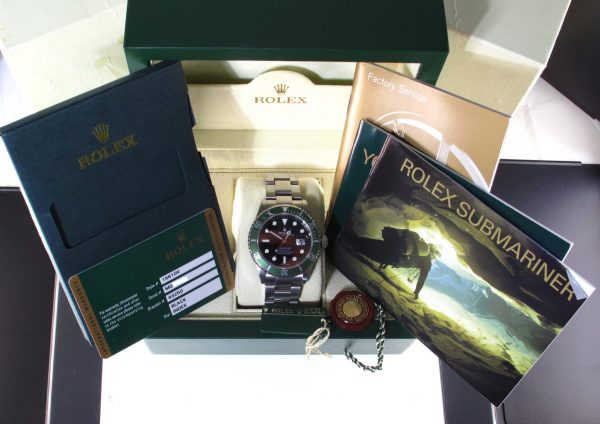 Pre-Owned 2007 Rolex Anniversary Submariner 40MM Watch With Black Maxi Index Dial And Green Bezel (The Kermit) With Oyster Band Model# 16610LV Box and papers