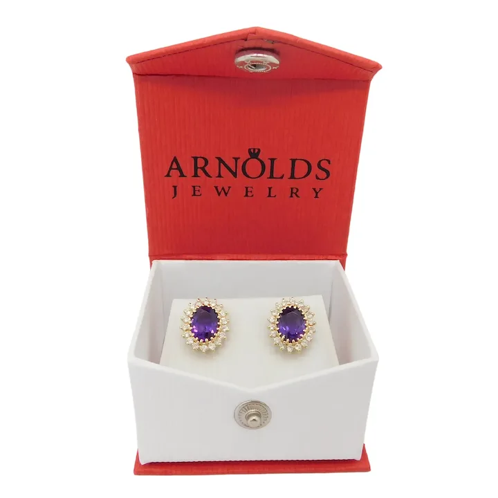 3.40ctw amethysts are haloed by .72ctw of round brilliant-cut diamonds.