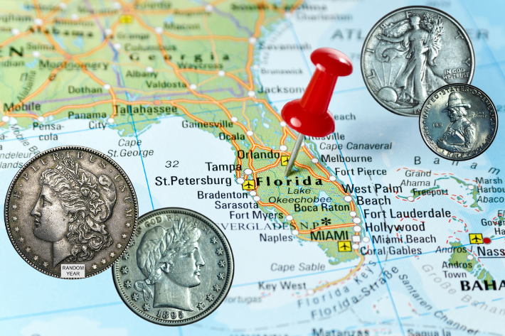 map of Florida with four coins on it