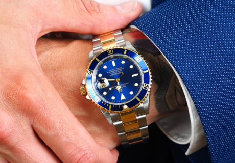 Two Tone Rolex Submariner with blue bezel and dial on male arm