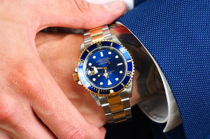 Two Tone Rolex Submariner with blue bezel and dial on male arm