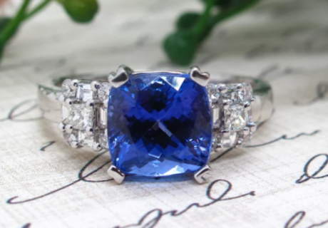 sapphire ring on swirl paper