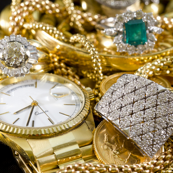 Pile of Gold Jewelry and watches