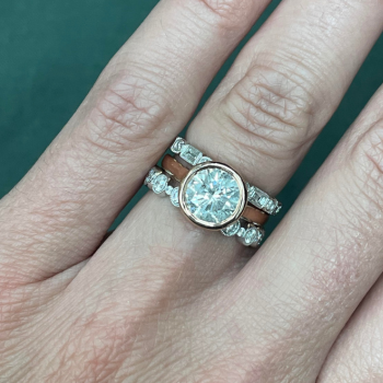 framing rose gold engagement ring with white gold