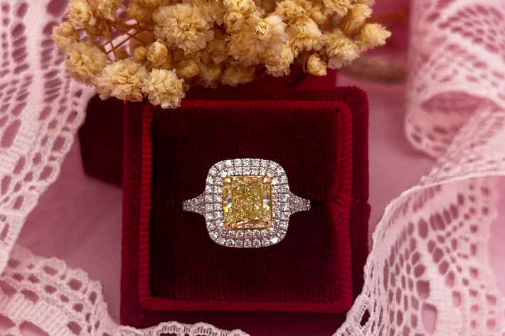 yellow diamond engagement ring with double diamond halo