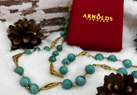 december birthstone turquoise necklace with Arnold Jewelers box in snowy setting