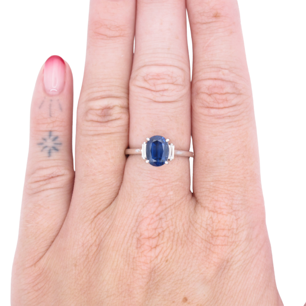 2.39ct Oval Blue Sapphire Three-Stone Ring 14K White Gold GIA worn