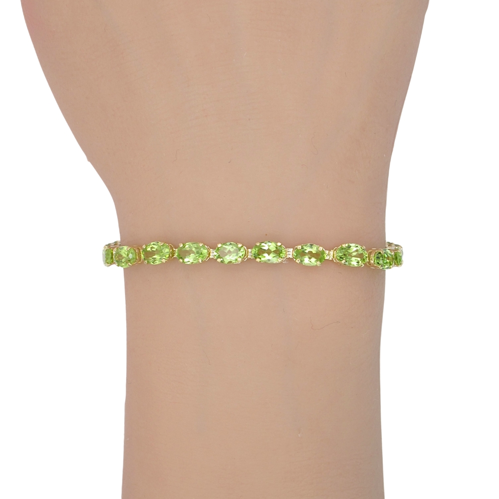 11.50ctw Peridot Line Bracelet 14K Gold worn 11.50ctw Peridot Line Bracelet 14K Gold worn