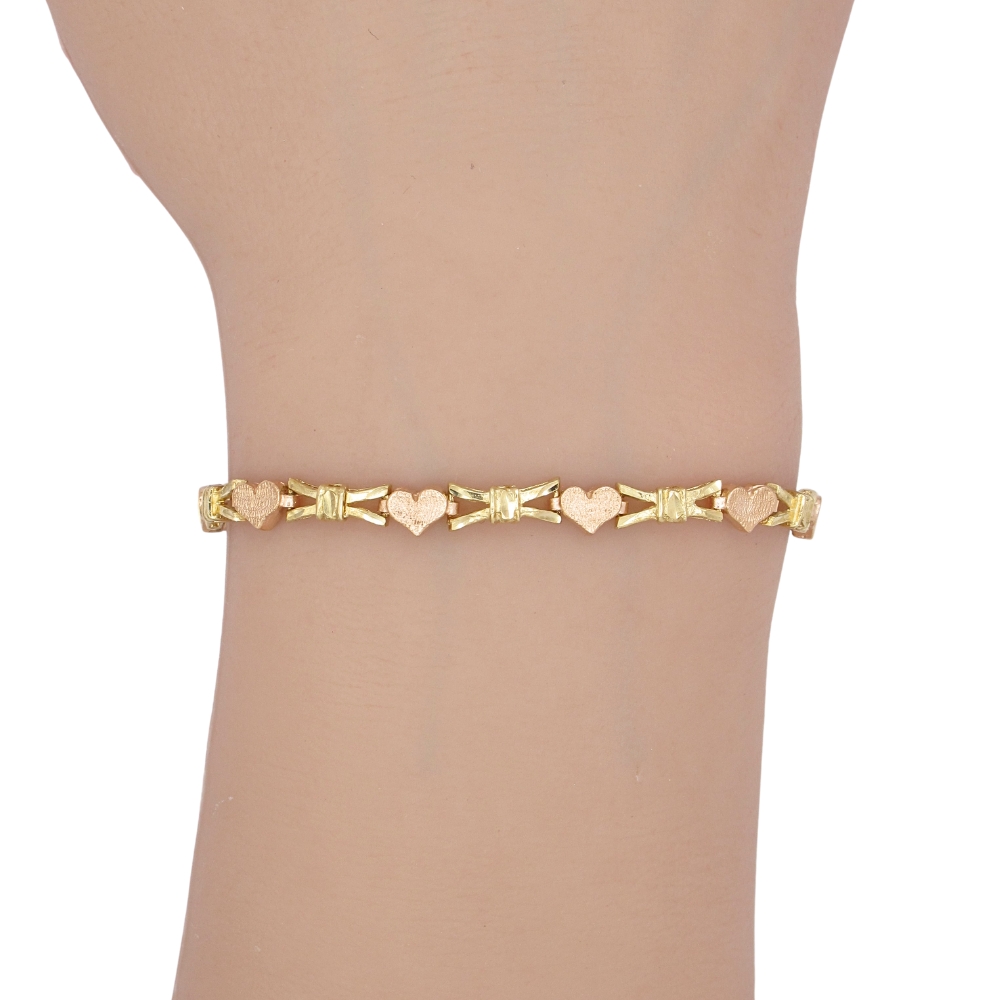 Heart & Bow Link Bracelet 14K Two-Tone Gold worn Heart & Bow Link Bracelet 14K Two-Tone Gold worn
