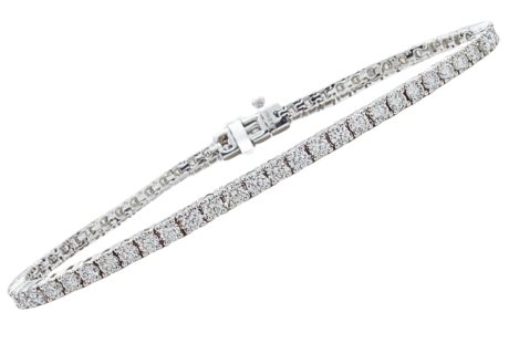 MEASUREMENT: 7'' wearable length, 3mm WEIGHT: 10.0 Grams GEM: (63) Round Brilliant Diamonds G Color, VS2 Clarity totaling 3.96ctw COMPOSITION: 14K White Gold
