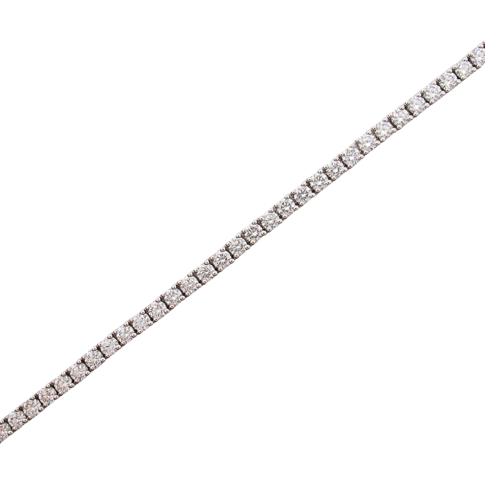 4 carat diamond line tennis bracelet white gold full MEASUREMENT: 7'' wearable length, 3mm WEIGHT: 10.0 Grams GEM: (63) Round Brilliant Diamonds G Color, VS2 Clarity totaling 3.96ctw COMPOSITION: 14K White Gold