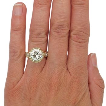 5 carat round brilliant statement engagement ring bezel hand
