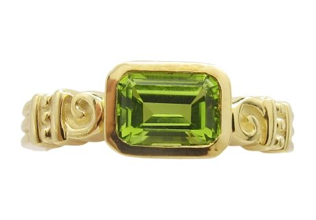 14K Yellow Gold Emerald-Cut Peridot Ring With Gold Design and Swirls Front View